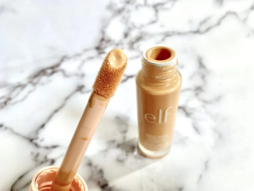 e.l.f. Halo Glow Liquid Filter applicator wand and open bottle.