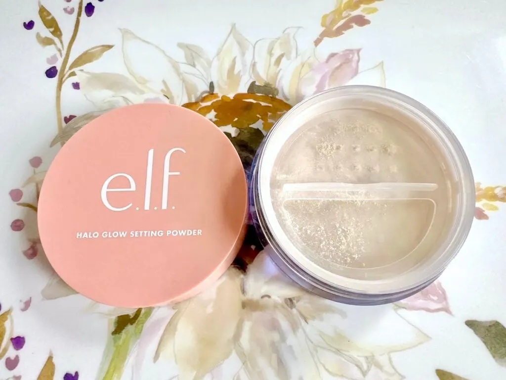 e.l.f. Halo Glow Setting Powder in the shade Light, open with lid.