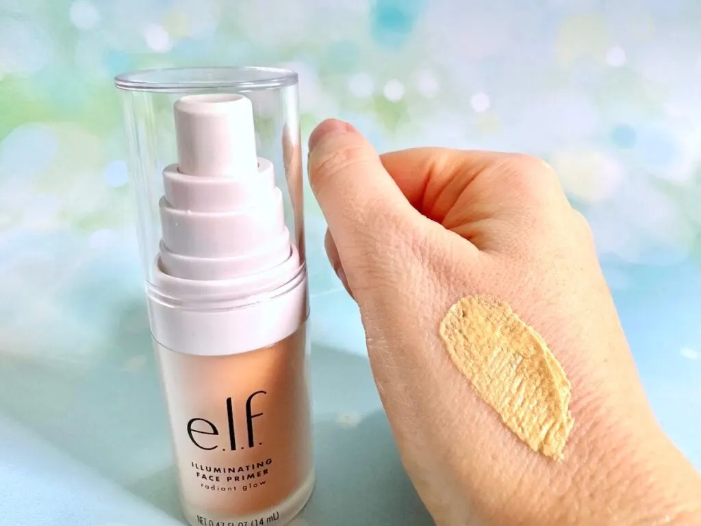 e.l.f. Illuminating Face Primer bottle next to sample on hand.