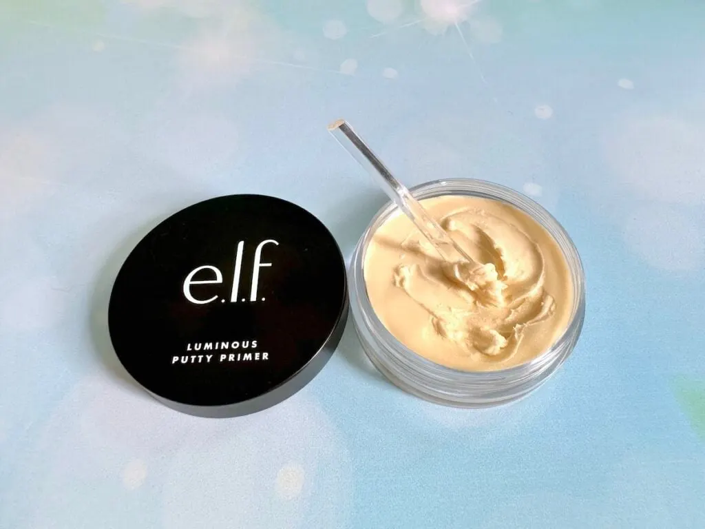 e.l.f. Luminous Putty Primer  jar open with clear cosmetic spatula in putty primer.