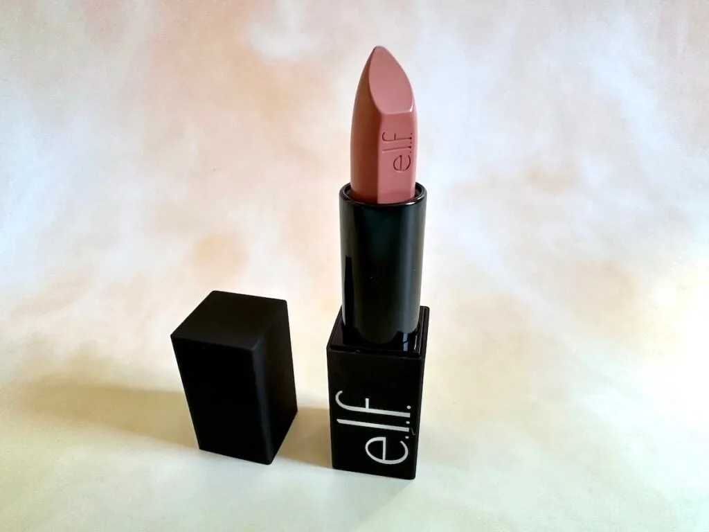 e.l.f O Face Satin Lipstick in the shade Dirty Talk, open tube with lid.