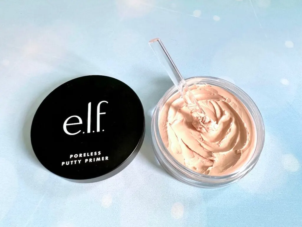 e.l.f. Poreless Putty Primer jar open with clear cosmetic spatula in putty.