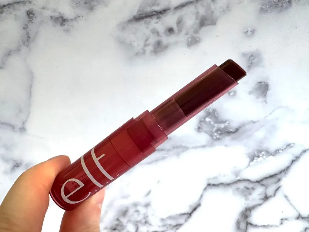 e.l.f. Sheer Slick Lipstick in Black Cherry, handheld.