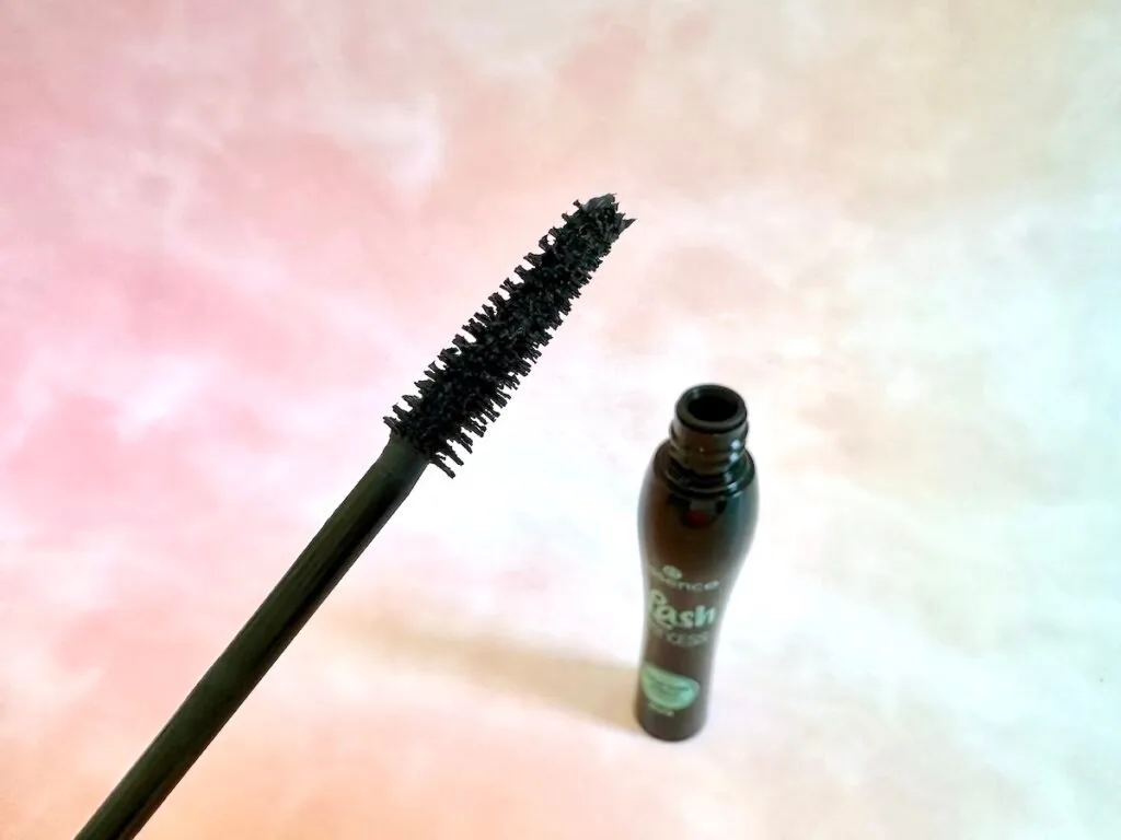 Essence Lash Princess False Lash Effect Mascara wand and open tube in background.