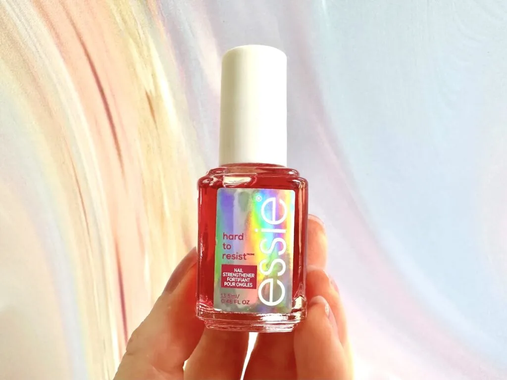 Essie Hard To Resist Nail Strengthener Glow & Shine, handheld.