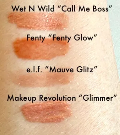 Fenty Gloss Bomb Dupe Swatches: Wet n Wild, e.l.f., and Makeup Revolution compared to Fenty Gloss Bomb in Fenty Glow shade on arm.