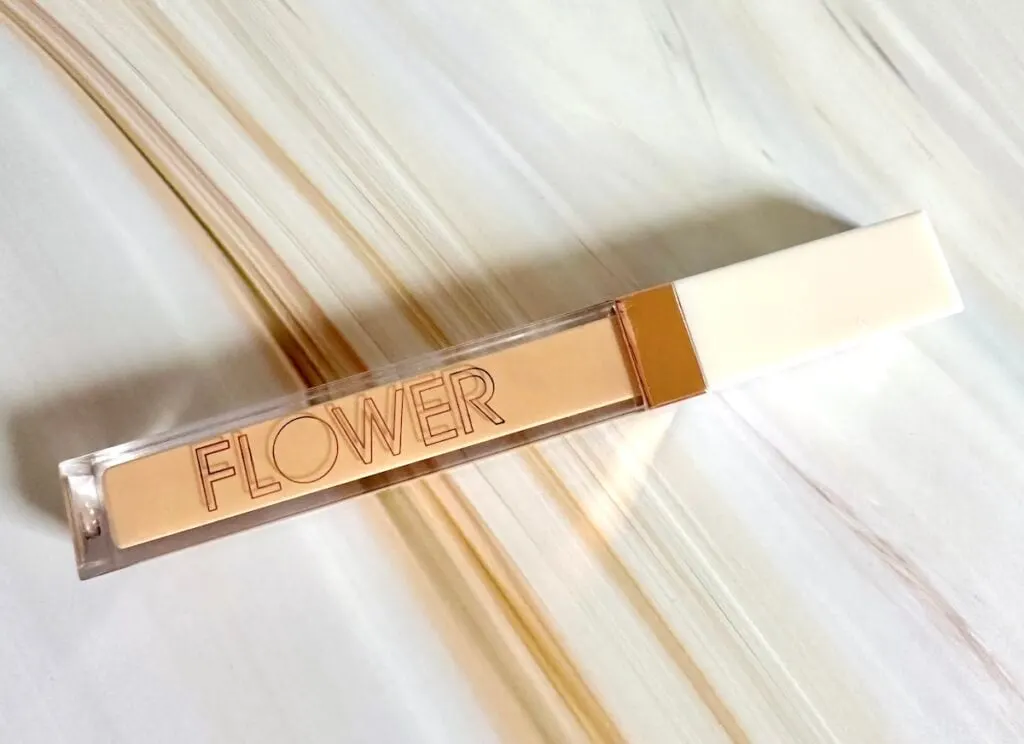 Flower Beauty Light Illusion Full Coverage Concealer in the shade Light, flatlay.