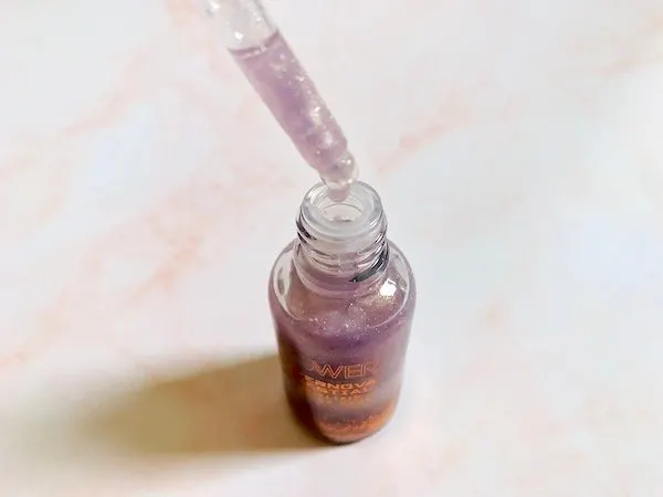 Flower Beauty Supernova Celestial Skin Elixir opened with dropper