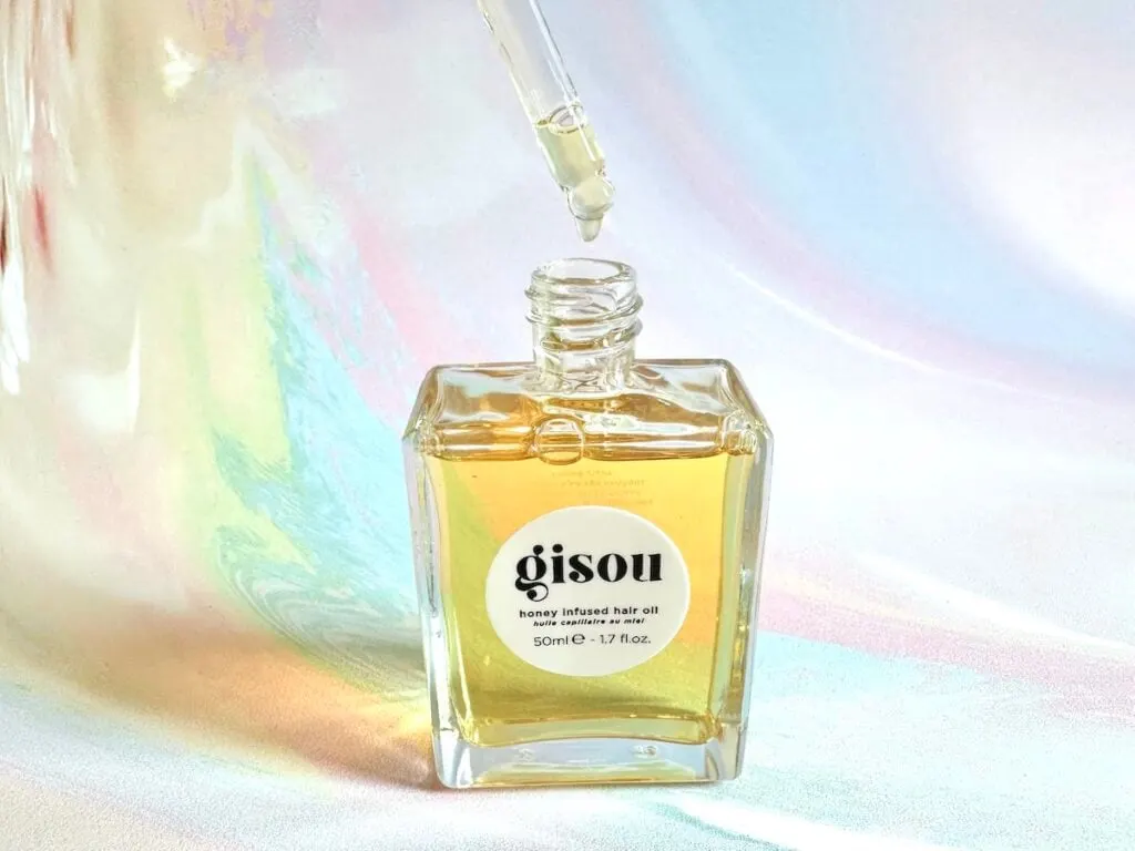 Gisou Honey Infused Hair Oil, open bottle with dropper.