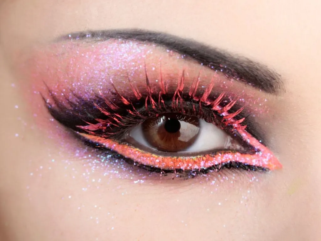 Pink and black glittery eyeshadow framing the eye.