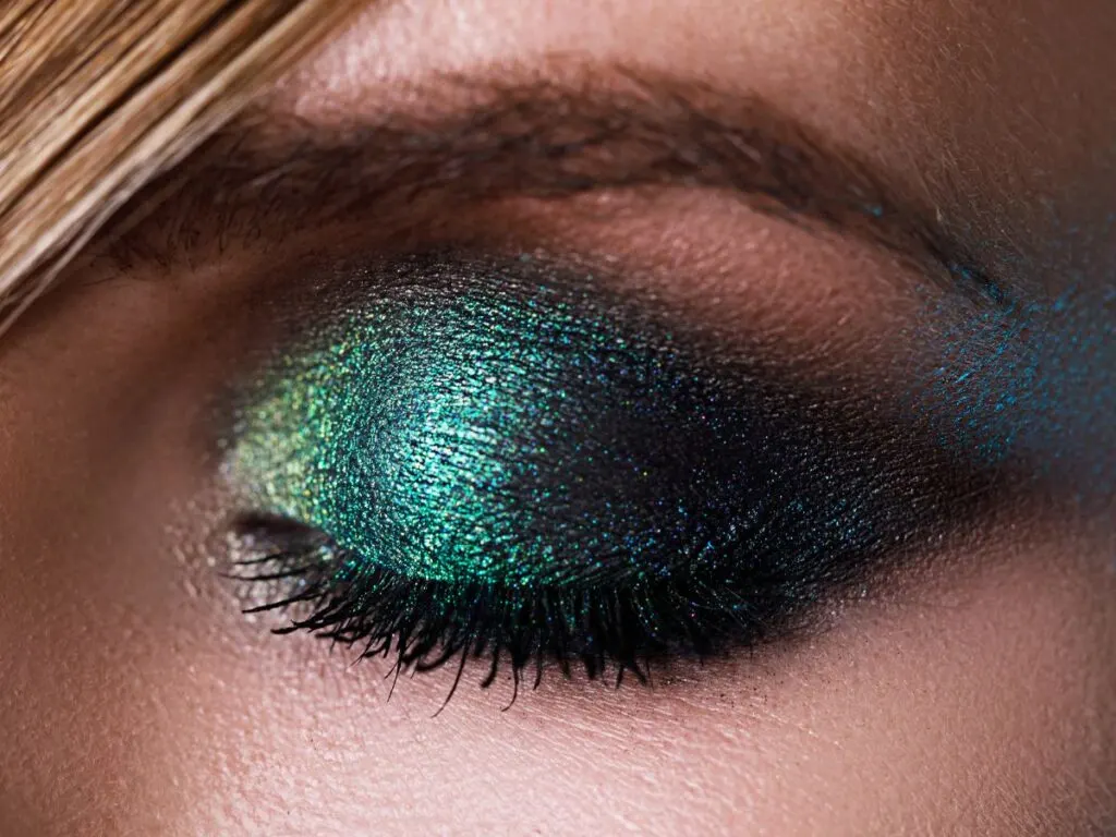 Emarld green glittery eyeshadow on closed eye.