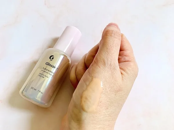 Glossier Future Dew Oil-Serum Hybrid bottle and sampled on hand