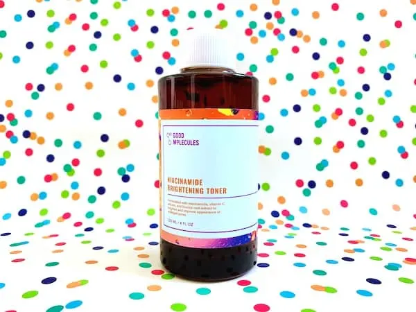 Good Molecules Niacinamide Brightening Toner on colorful dot background