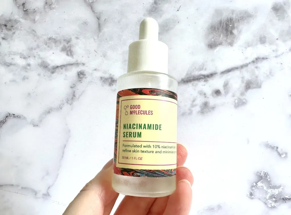 Good Molecules Niacinamide Serum, handheld.