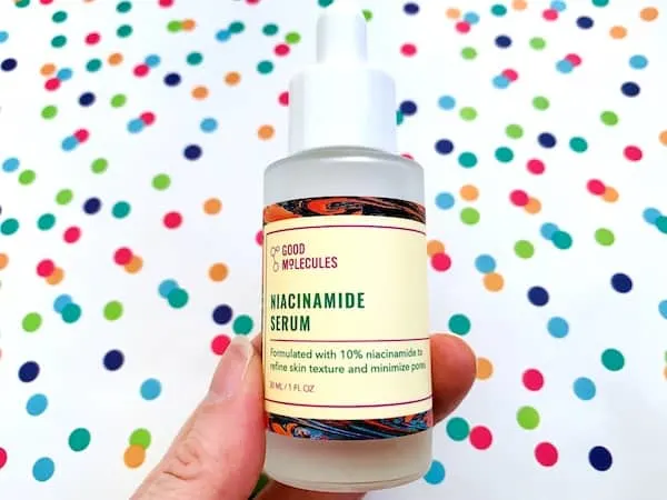 Good Molecules Niacinamide Serum on colorful dot background