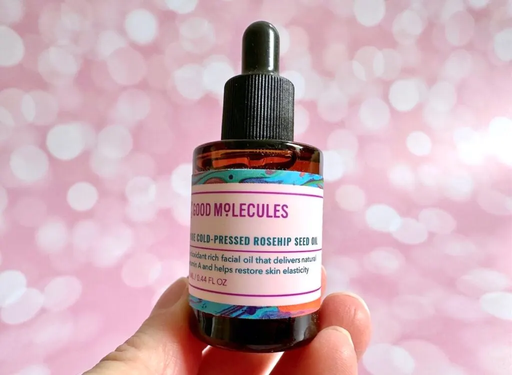 Good Molecules Pure Cold-Pressed Rosehip Seed Oil, handheld.