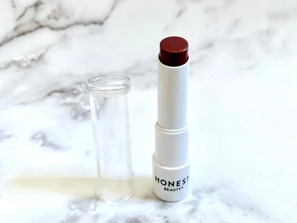 Honest Beauty Tinted Lip Balm in the shade Plum Drop.