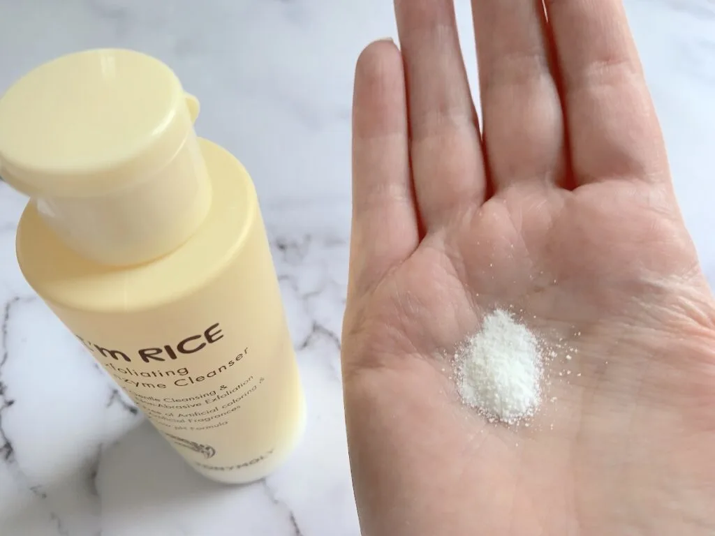 TONYMOLY I'm Rice Exfoliating Enzyme Cleanser powder sampled on palm of hand.