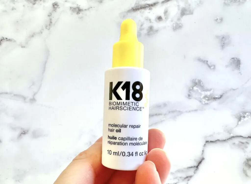 K18 Molecular Repair Hair Oil, handheld.