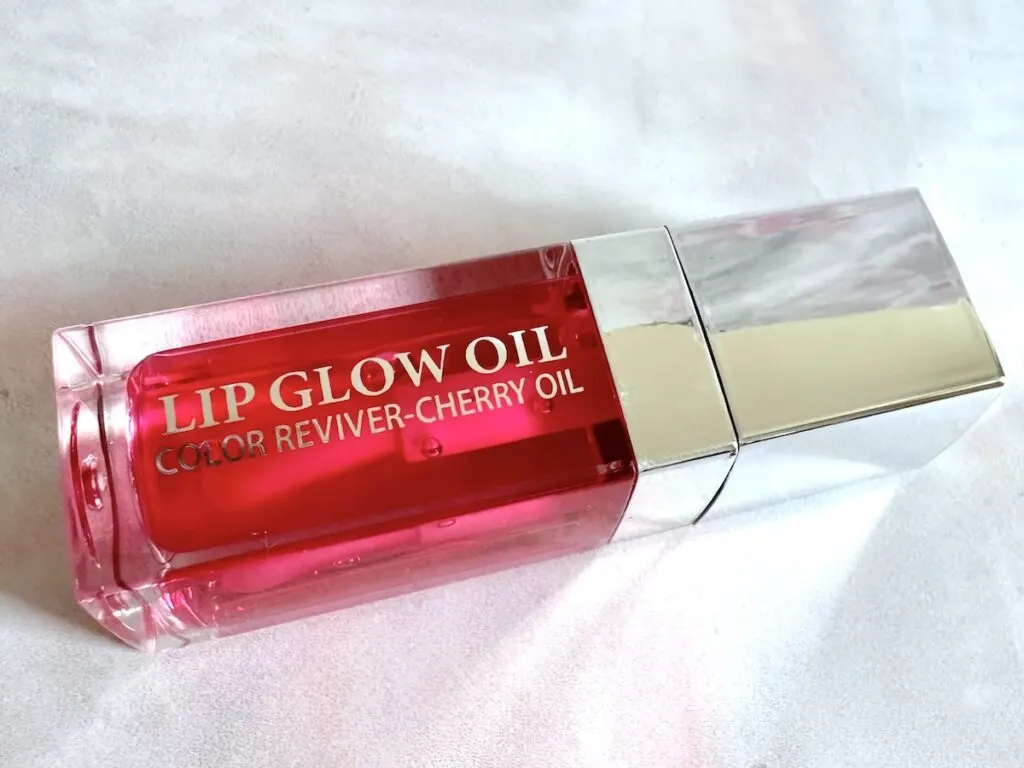 Kyda Lip Glow Oil in the shade Cherry, flatlay.