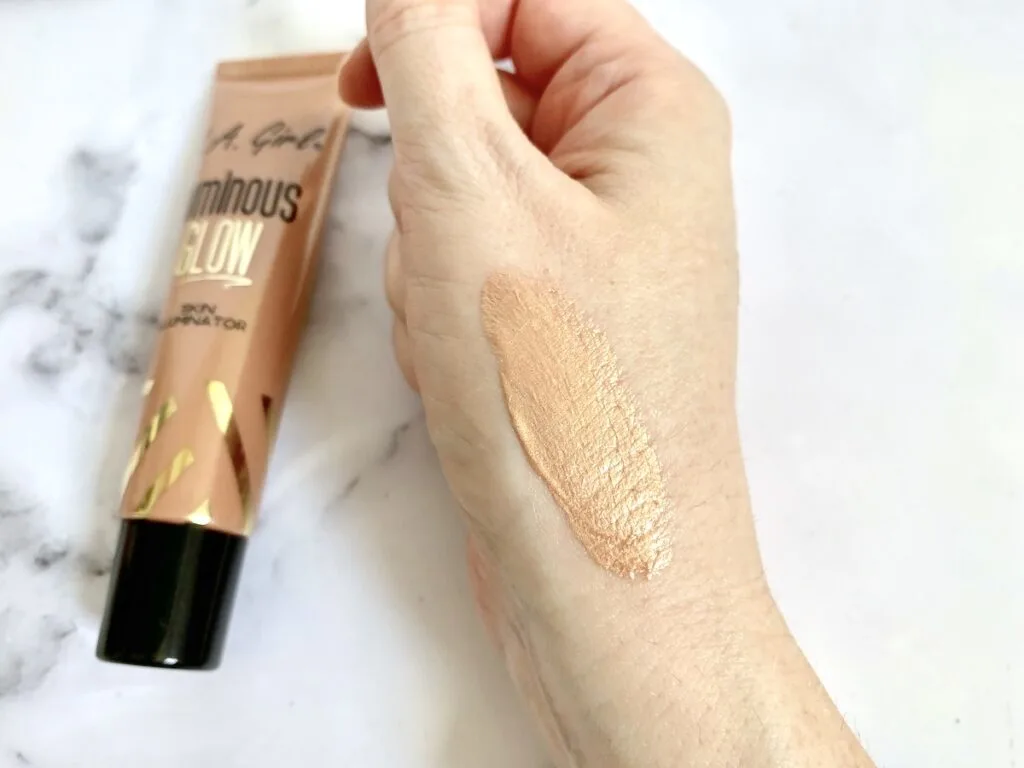 L.A. Girl Luminous Glow Skin Illuminator in the shade Sunlit sampled on hand.