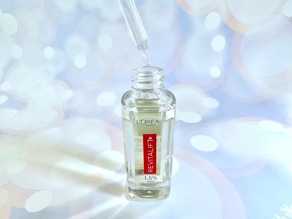 L'Oréal Revitalift 1.5% Pure Hyaluronic Acid Serum, open bottle with dropper applicator.