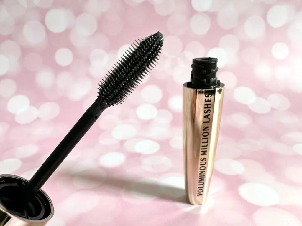 L’Oreal Voluminous Million Lashes Mascara in the shade Blackest Black, open tube with mascara wand.