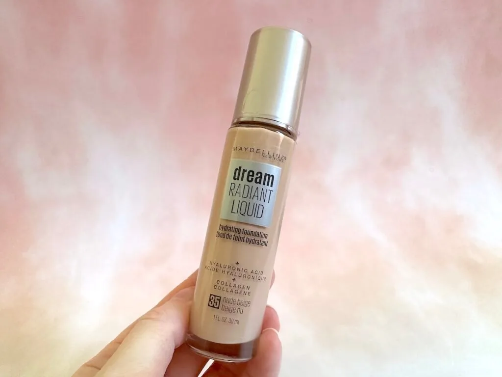 Maybelline Dream Radiant Liquid Hydrating Foundation handheld. Shade is nude beige.