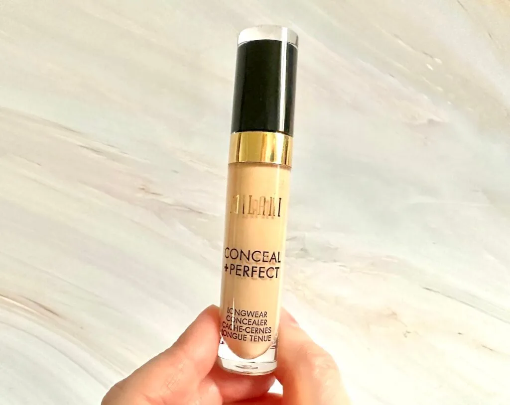 Milani Conceal + Perfect Concealer in the shade Light Beige, handheld.