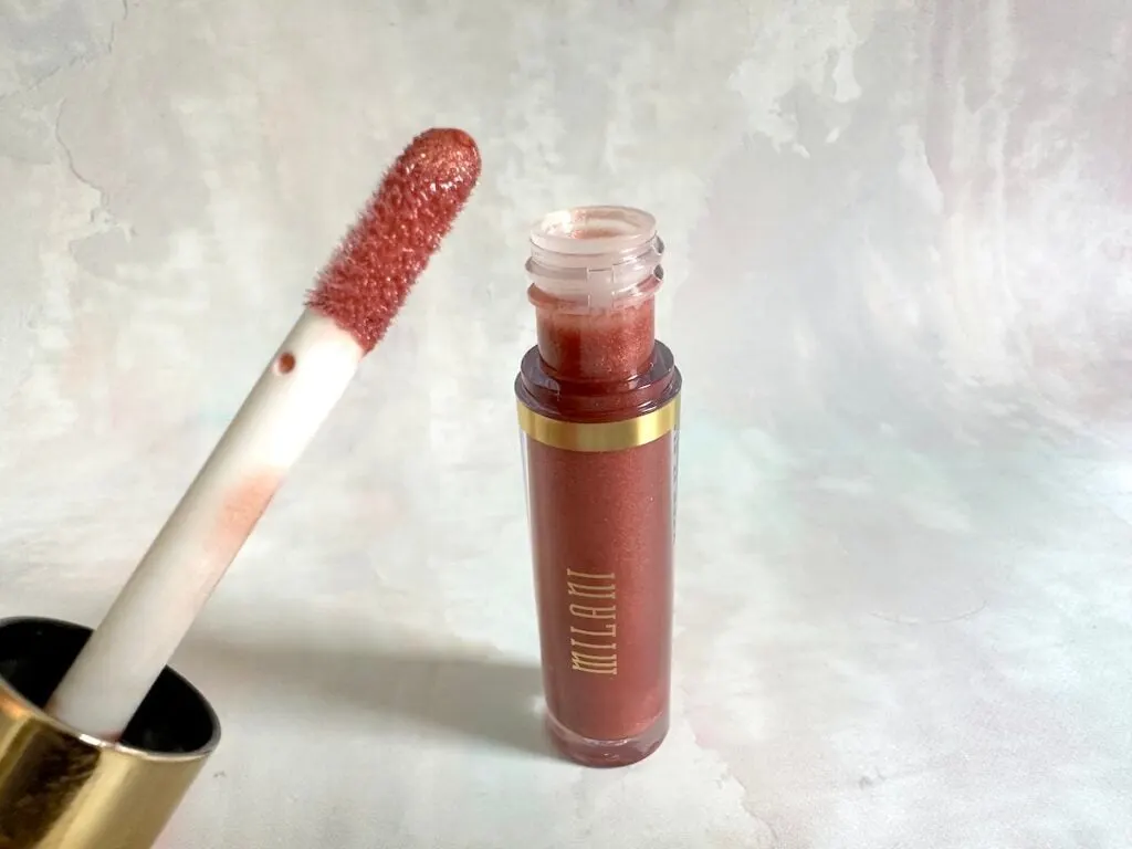 Milani Keep It Full Nourishing Lip Plumper in the shade Rosy Bronze, open with applicator.