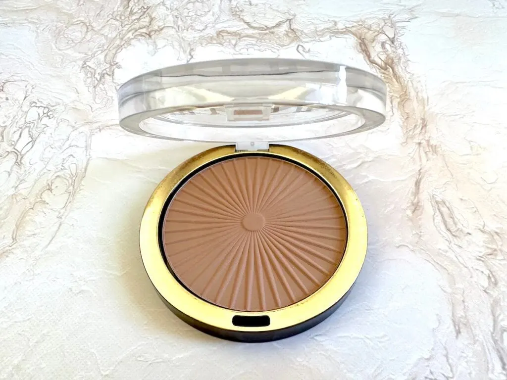 Milani Silky Matte Bronzing Powder in the shade Sun Kissed, open compact.