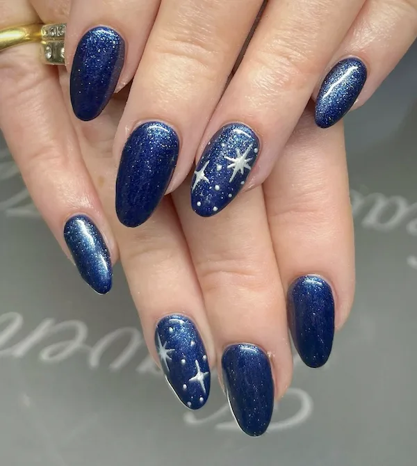 Deep blue twinkle winter nails.