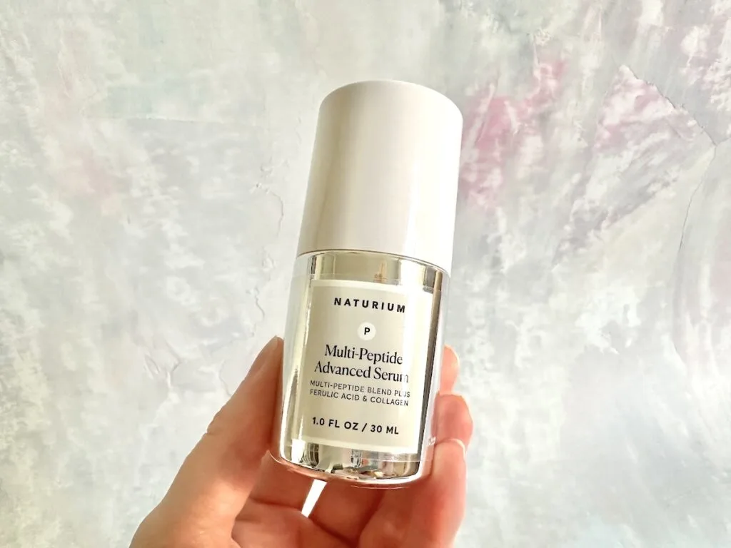 Naturium Multi-Peptide Advanced Serum, handheld.