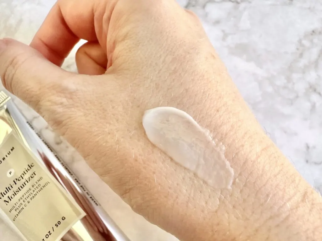 Naturium Multi-Peptide Moisturizer, sampled on hand.