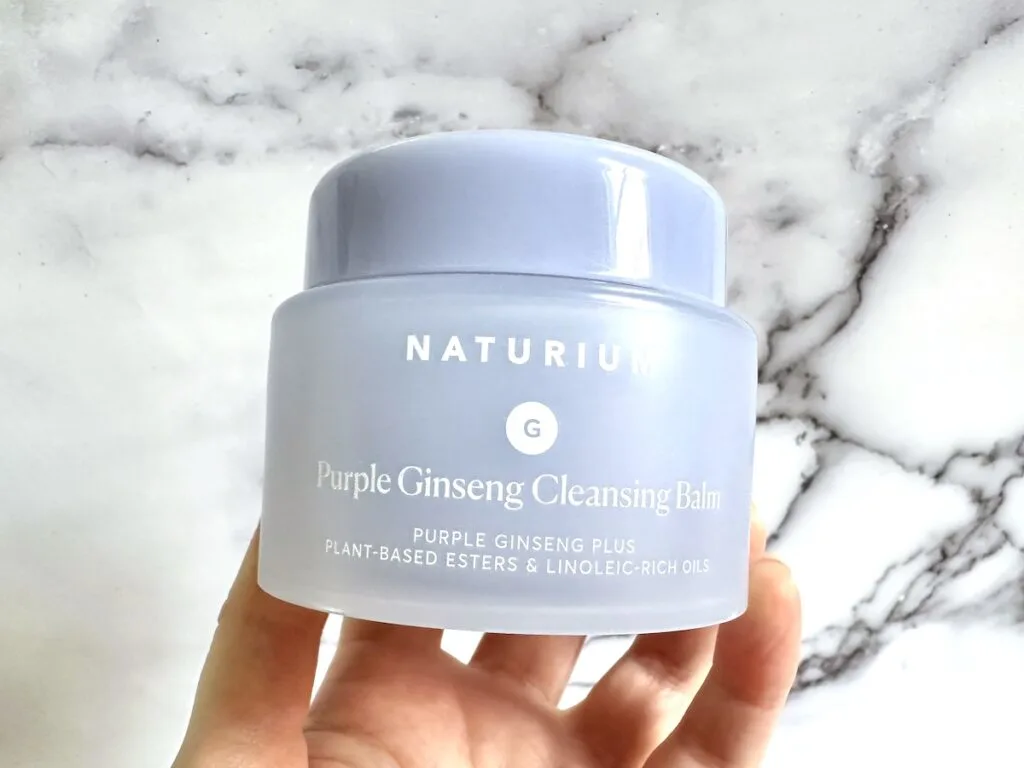 Naturium Purple Ginseng Cleansing Balm, handheld.