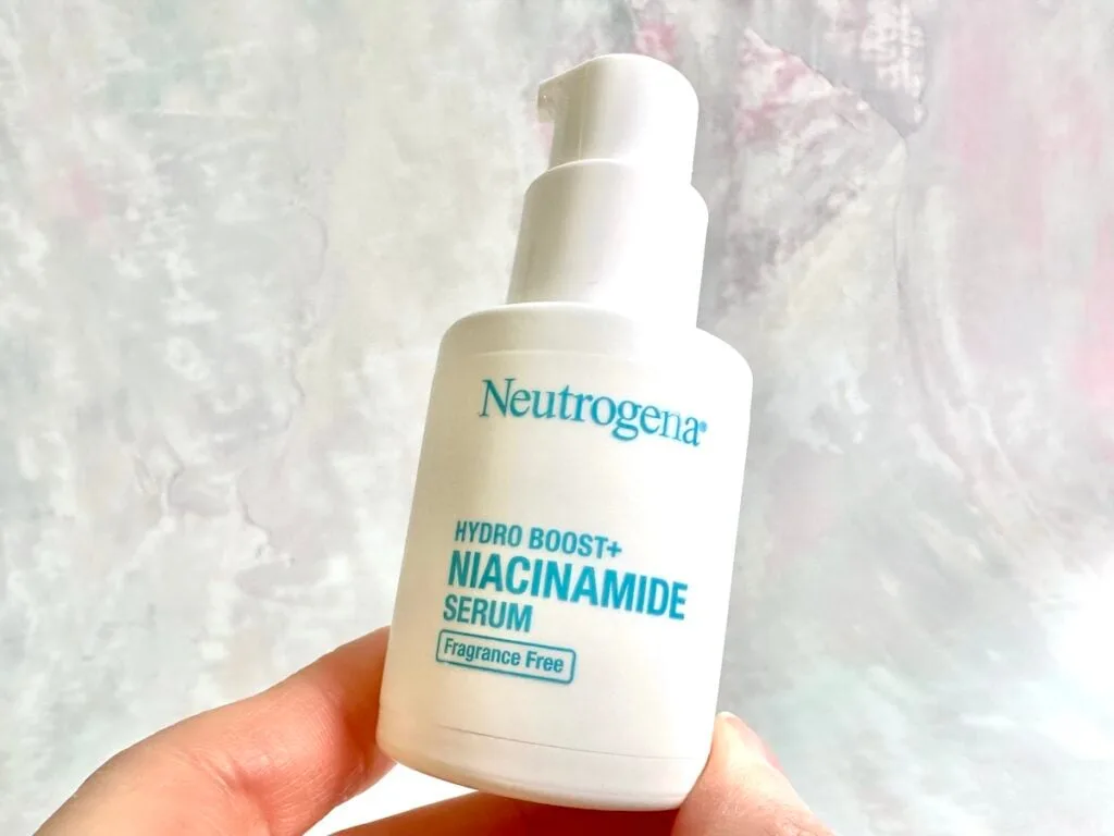 Neutrogena Hydro Boost+ Niacinamide Serum, handheld.