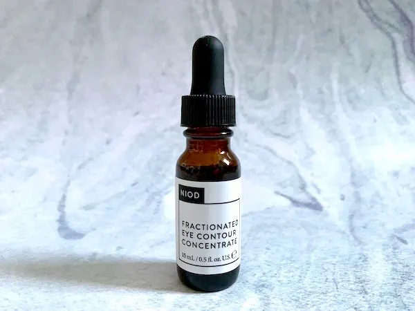 NIOD Fractionated Eye Contour Concentrate serum on blue background