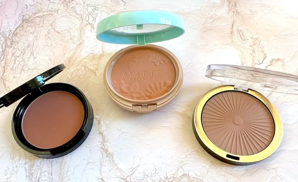 Charlotte Tilbury Bronzer dupes from NYX, Milani and Physicians Formula, open compacts.