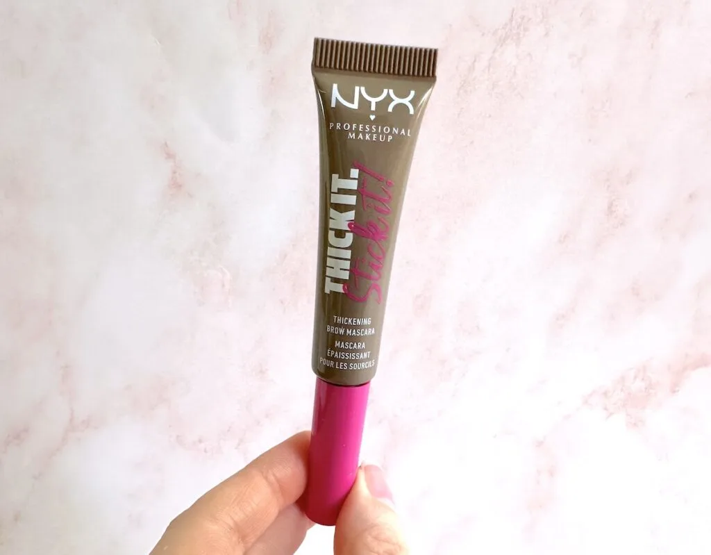 NYX Thick It. Stick It! Thickening Brow Mascara in the shade Taupe, handheld.