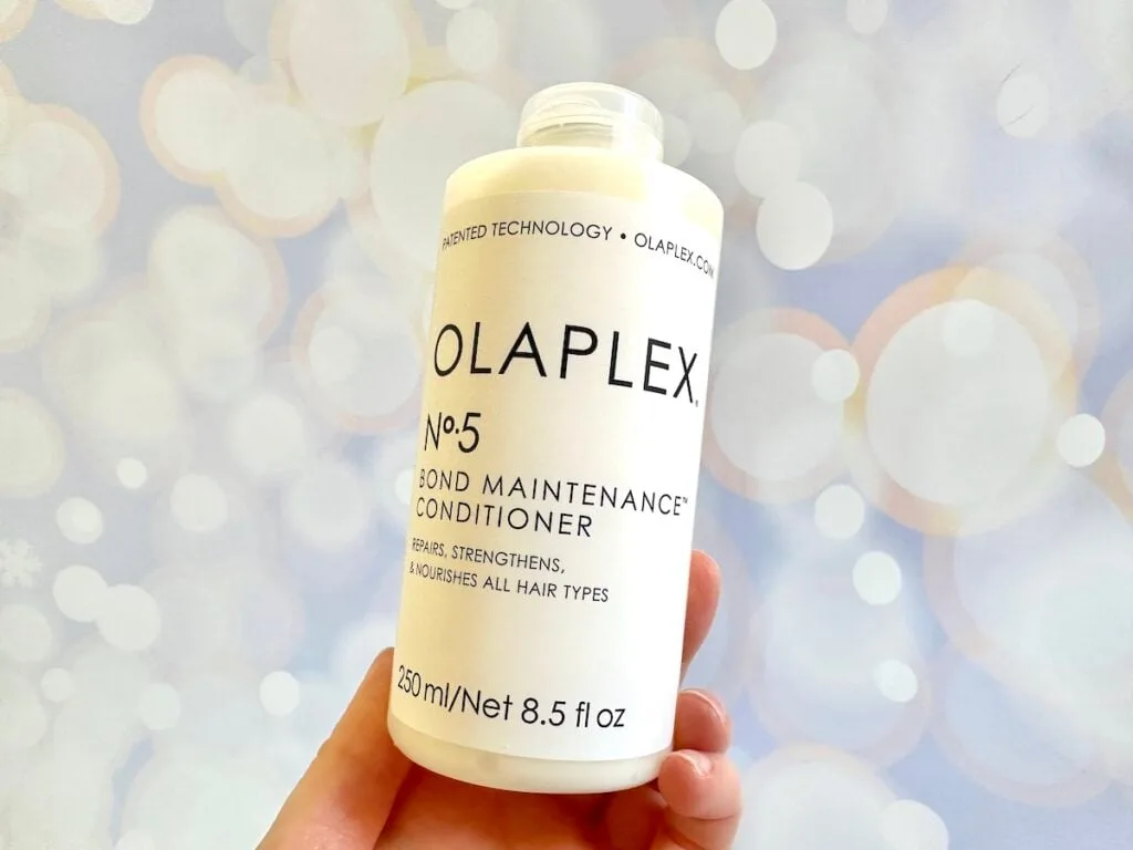 Olaplex No. 5 Bond Maintenance Conditioner, handheld.