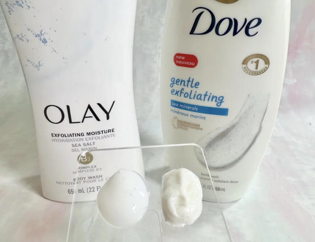 Olay Exfoliating Body Wash with Sea Salts and Dove Gentle Exfoliating Body Wash with Sea Minerals, sampled on clear spatula.