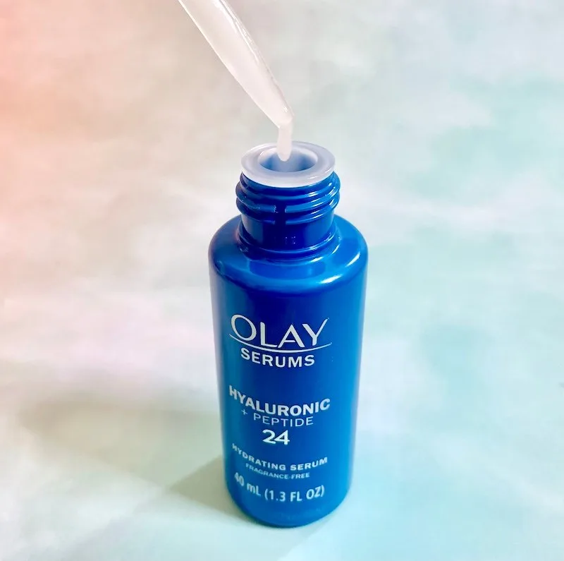 Olay Hyaluronic + Peptide 24 Serum open and sampled with dropper.