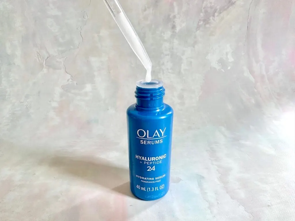 Olay Hyaluronic + Peptide 24 Serum, open bottle with dropper.