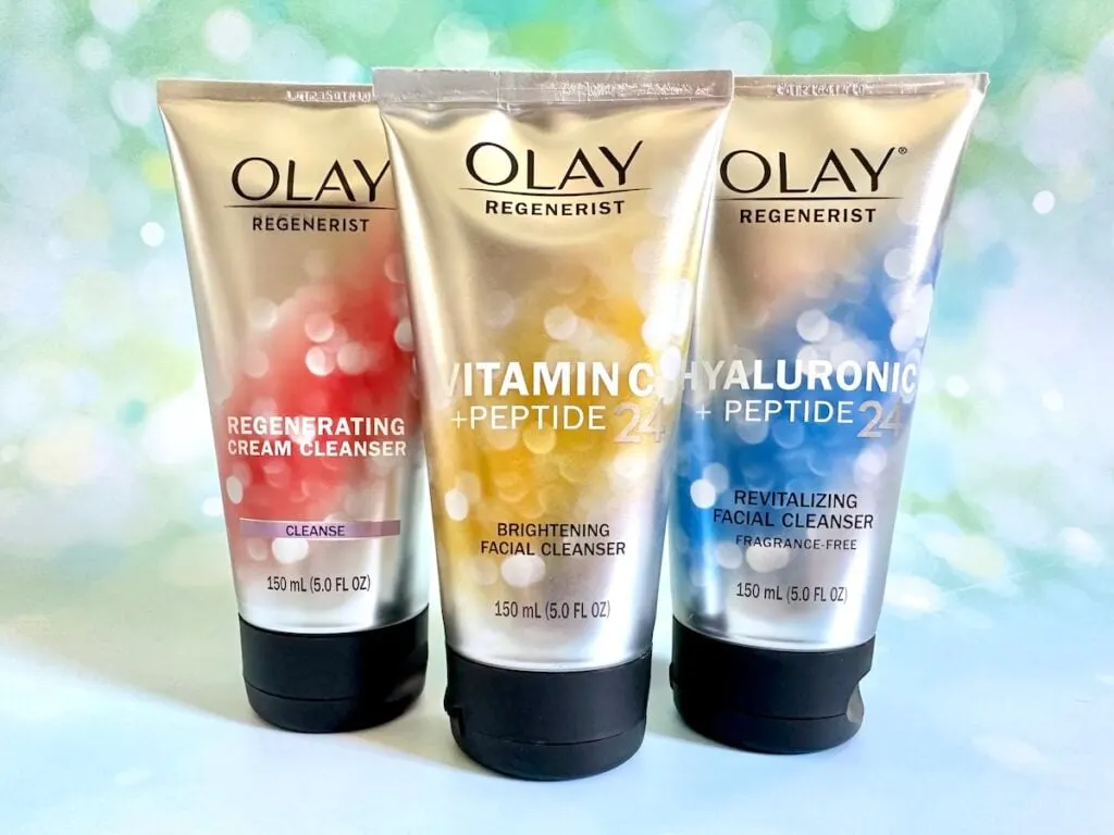 Best Olay Products for Your 40s: Olay Regenerist Regenerating Cream Cleanser, Vitamin C + Peptide 24 Brightening Cleanser, and Hyaluronic + Peptide 24 Revitalizing Cleanser.