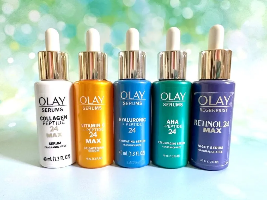 Best Olay Products for 40s: 5 Olay Regenerist serums side by side: Collagen Peptide 24 MAX, Vitamin C + Peptide 24 MAX, Hyaluronic + Peptide 24, AHA + Peptide 24, and Retinol 24 MAX.