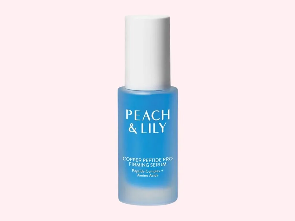 Peach & Lily Copper Peptide Pro Firming Serum on pink background.