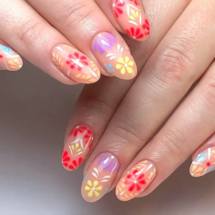 Peach, red, yellow, purple flower nails.