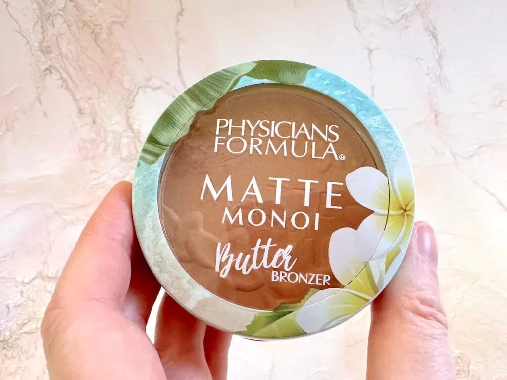 Physicians Formula Matte Monoi Butter Bronzer in the shade Sunkissed, handheld.