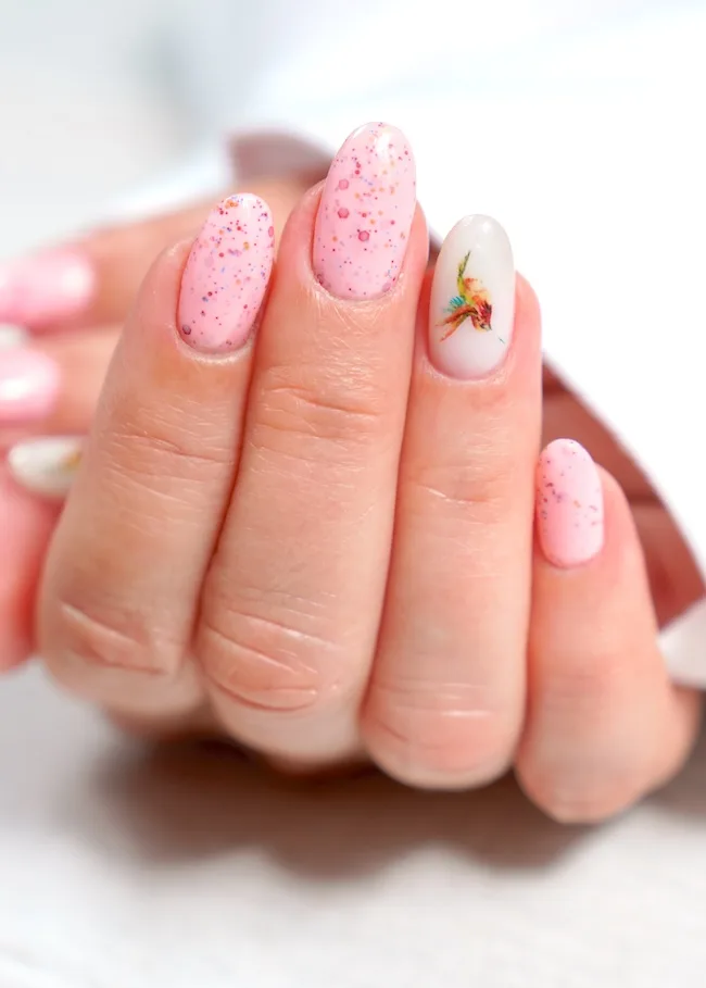 Pink speckle flower nails.