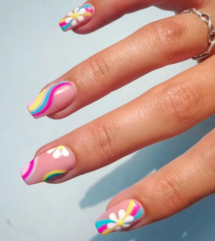 Rainbow flower swirl nails.